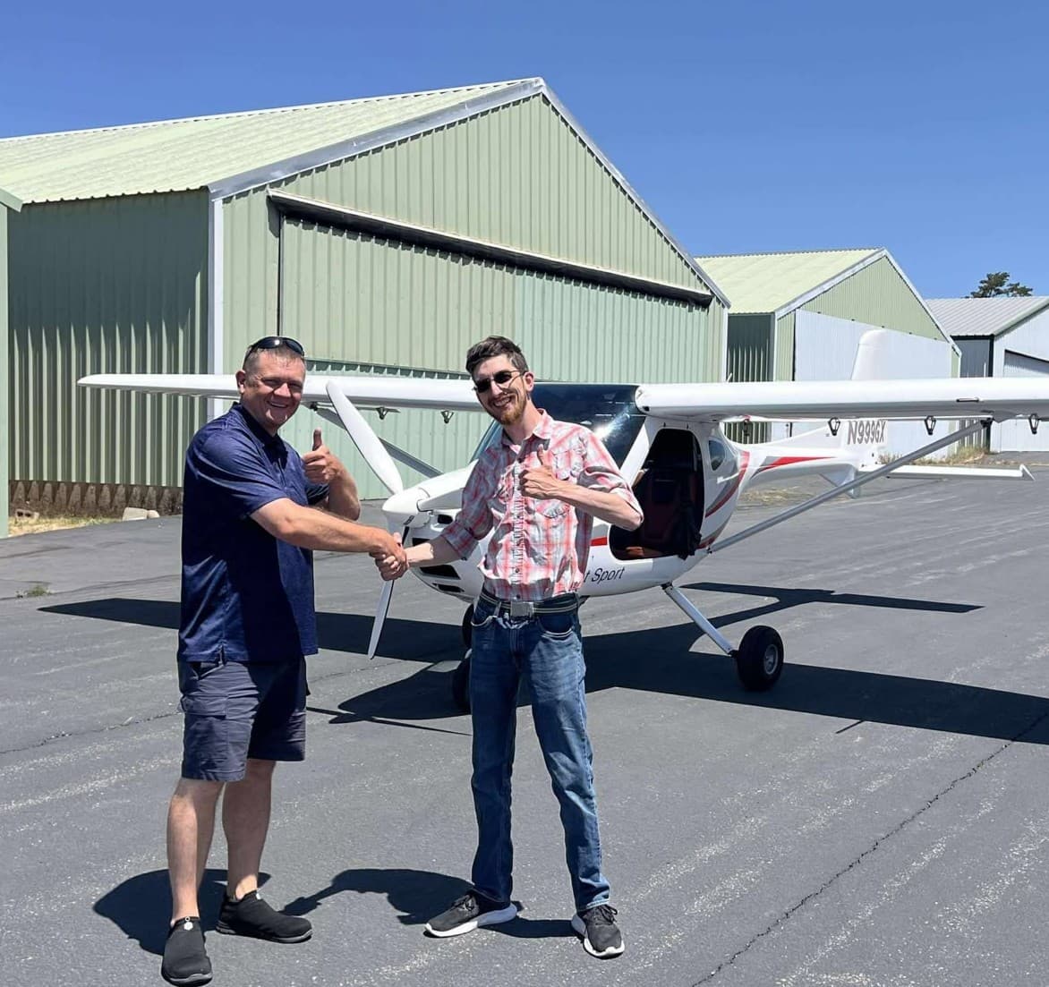 Justice McCracken at the airfield with a light sport aircraft